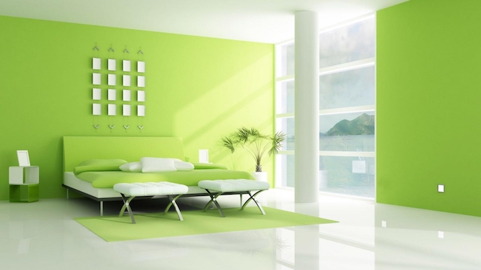schlafzimmer einrichten, ein schlafzimmer mit grünen wänden und einem bett mit grünen und weißen kissen und eine weiße vase mit grünen pflanzen, wandfarbe schlafzimmer