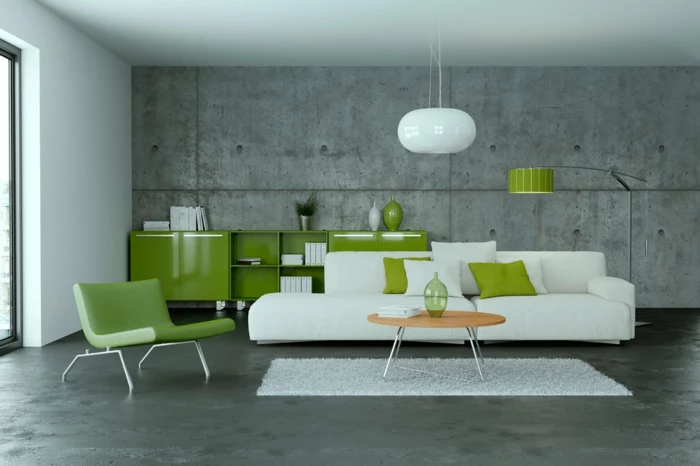 eine grüne Einrichtung, Bodenbelag Betonoptik, weiße Lampe, weißes Sofa und weißer Teppich