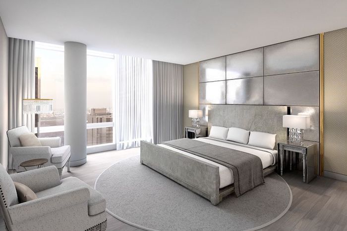 moderne schlafzimmer in weiß und grau, runder teppich, boden aus holz, lampen mit glasstielen