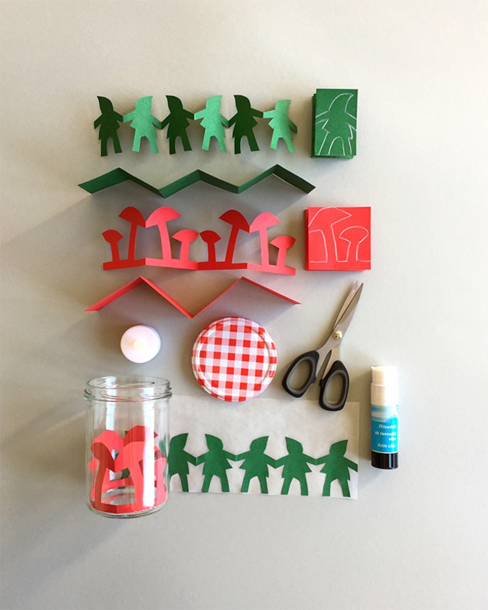 Laterne Bastelset, kleine Figuren aus grünem und rotem Papier, eine Schere, ein Deckel