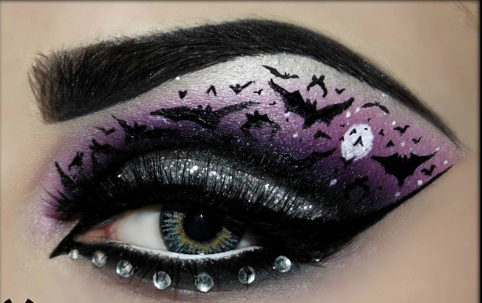 halloween gesicht schminken, akzent auf die augen, kleine tierchen bath zeichnen am augenlid, steine ankleben, lila lidschatten