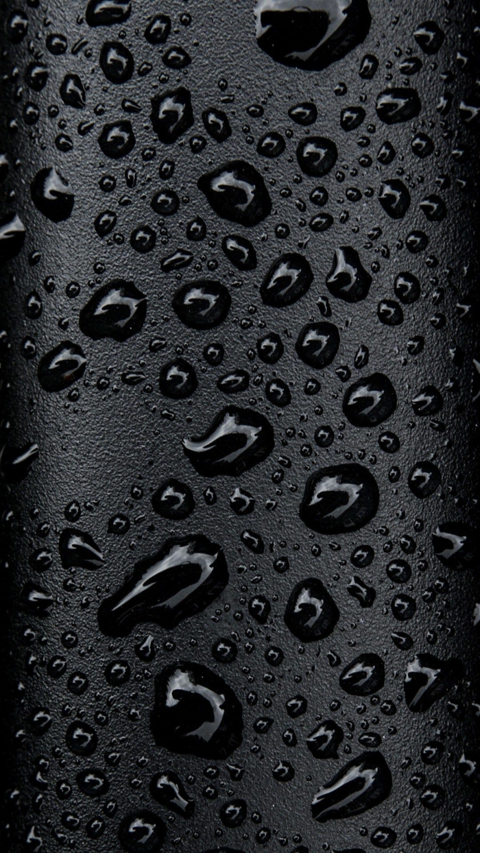 schwarzer Hintergrund wie aus Leder mit kleinen Tropfen die glänzen, Bildschirmhintergrund