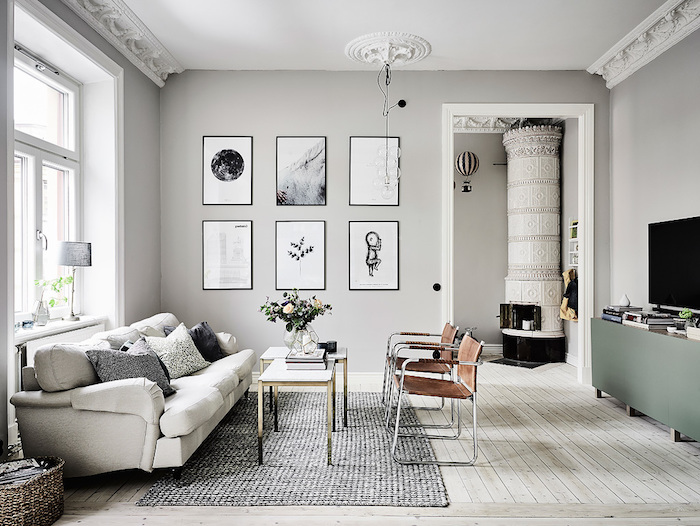 wandfarbe grau mit vielen symmetrischen wandbildern dekorierenm großes wohnzimmer