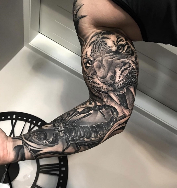 tattoo arm mann, tiger und skorpion, detaillierte tätowierung in schwarz grau