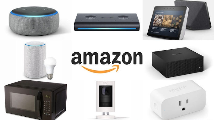 ein kleiner schwarzer Mikrowellenherd, der logo von amazon, graue lautsprecher und ein tablet, produkte von amazon 