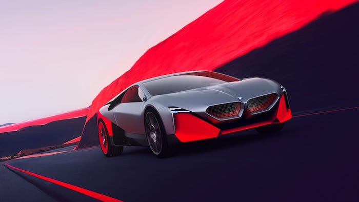 weg und grauer wagen, das neue elektroauto von bmw namens bmw next m vision
