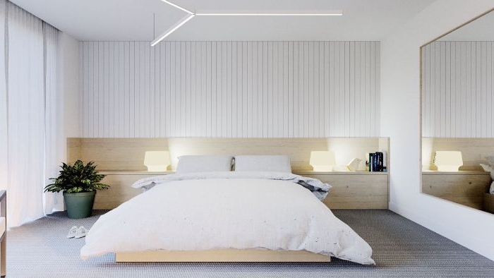 minimalistisch leben, ein dezentes design, doppelbett, riesengroßer spiegel, pflanze auf dem boden
