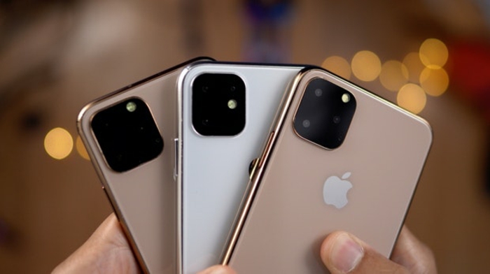 drei iPhones, iPhone 11 in den Händen von einem iPhone Besitzer, edle Farben