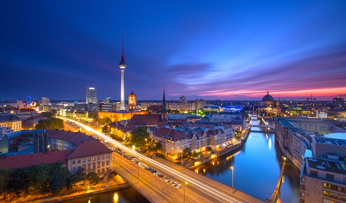 berlin skyline city panorama with blue sky sunset and traffic