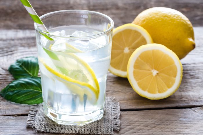 glass of water with fresh lemon juice