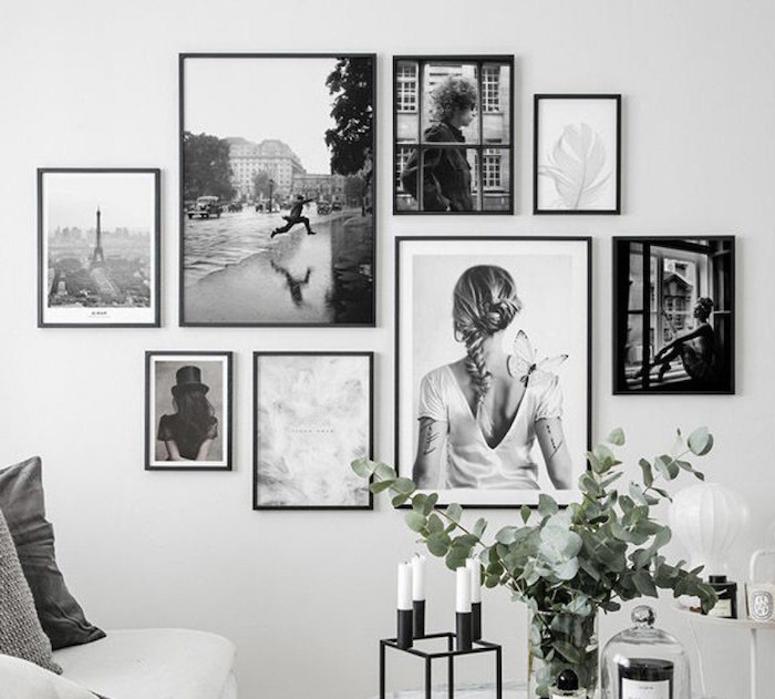 schöne schwarz weiße fotografien wohnzimmer wand ideen kleine und große fotos fotowand gestalten einrichtung wohnzimmer ideen und inspiration grüne zweige weiße kerzen minimalistisches design