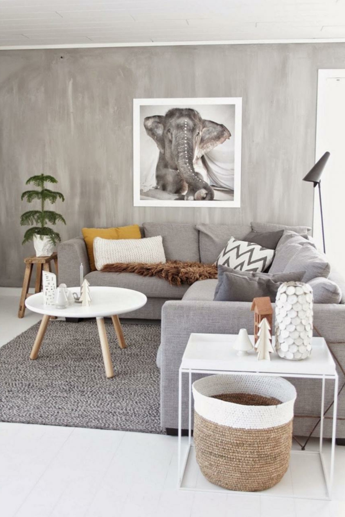 neutrale farben einrichtung graues ecksofa weißer runder kaffeetisch bild von einem elefanten an die wand scandi style wohnen
