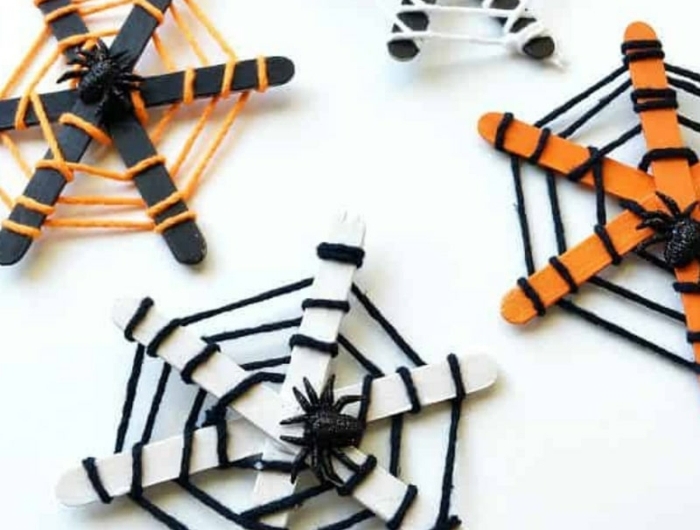 halloween dekoration selber machen diy deko inspiration spinnennetz basteln mit eisstäbchen in orange und weiß deko ideen und inspiration
