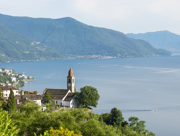 church in ronco sopra ascona on alpine lake maggiore with mountain