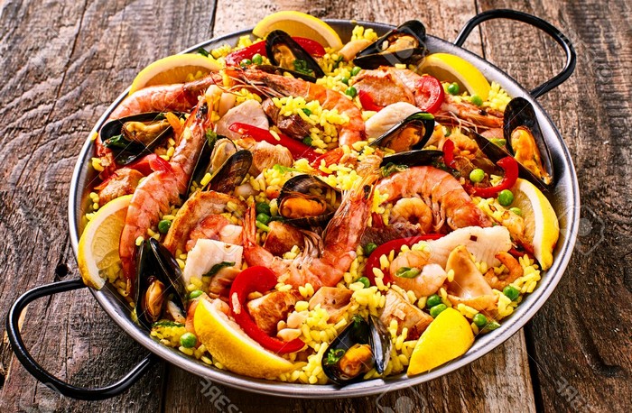 colorful seafood paella dish with shellfish