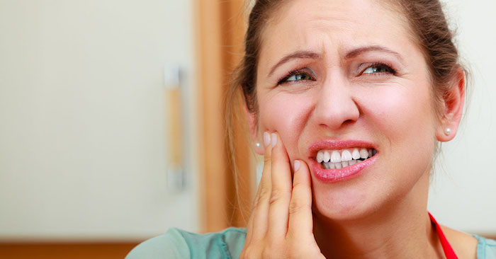 woman suffering from toothache tooth pain.