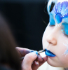 portrait of little girl during the face painting session