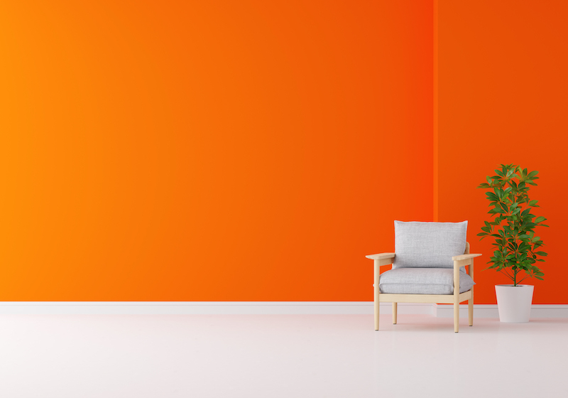 gray armchair in orange living room with copy space for mockup, 3d rendering