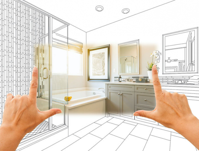 hands framing custom master bathroom photo section with drawing behind