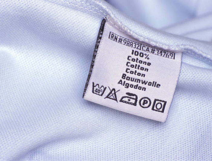 washing label on white cloth, close up