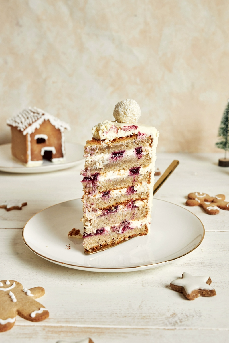 vertical shot delicious christmas cake with gingerbread decorations coconut almond ball