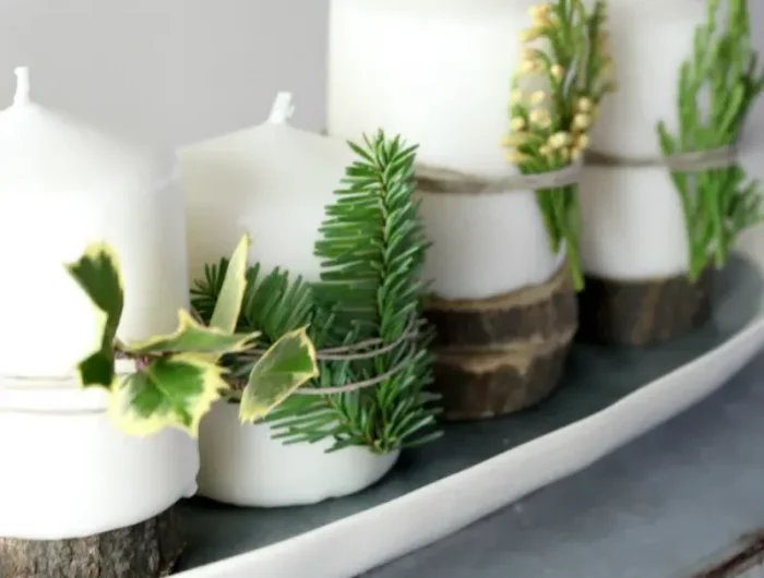 adventskranz kreativ weiße kerzen dekoriert mit grünen zweigen