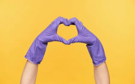 horizontal photo raised hands dressed rubber gloves showing love sign forming heart with fingers while being isolated yellow background 295783 11775