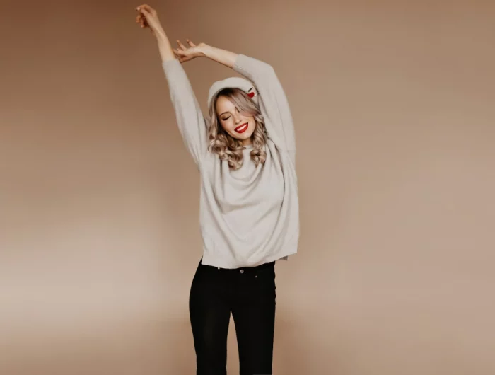 shapely woman brown sweater stretching studio 197531 12703