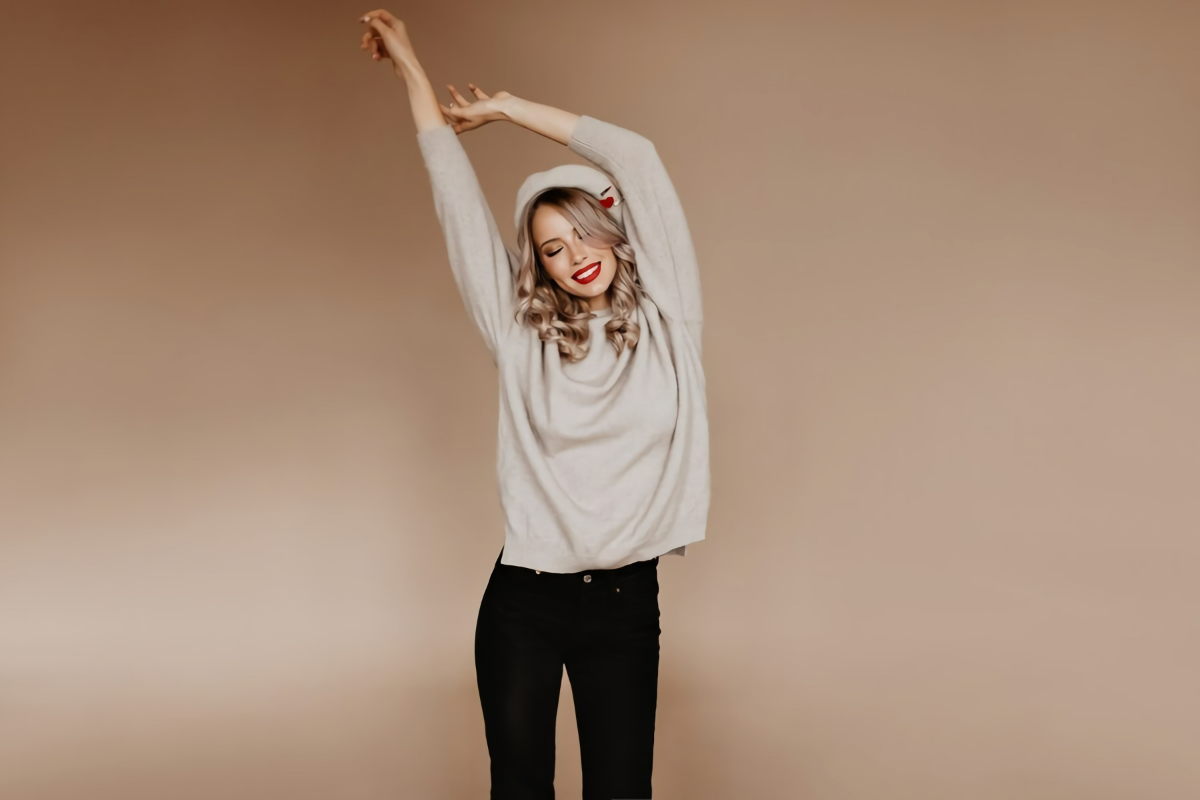 shapely woman brown sweater stretching studio 197531 12703