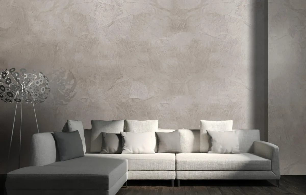 perlmutt effekt schimmer optik wandfarbe graues sofa dekokissen