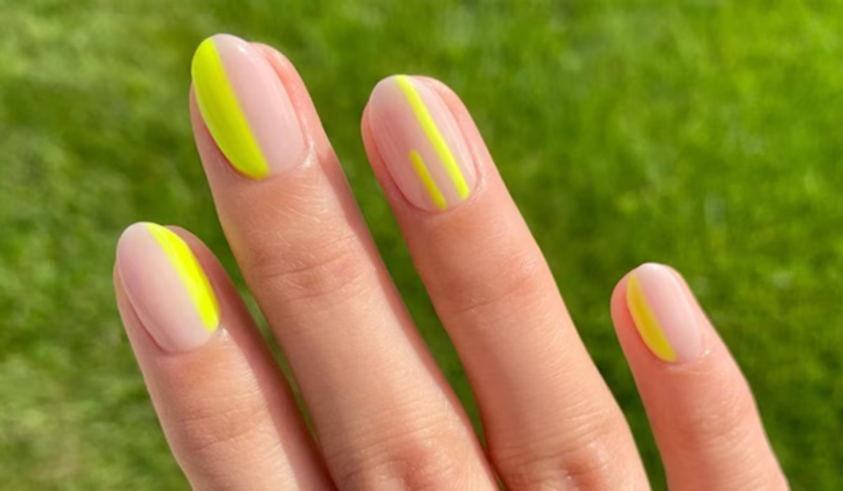 negativraum nagelkunstdesign mit gelbem nagellack