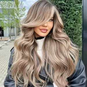 frisuren mit schraegem pony lange wellige haare balayage blonde strahnen grosser seitlicher pony mastersofbalayage